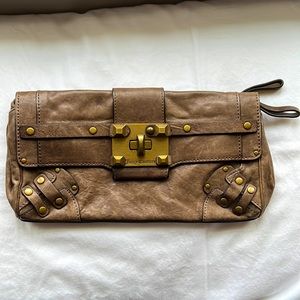 Juicy couture brown leather clutch with gold hardware.